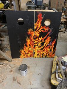 handpainted fire cornhole boards